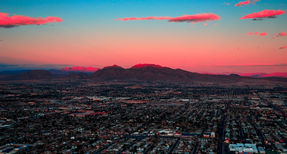 Stunning sunrise over Albuquerque, New Mexico, highlighting the city's landscape and surrounding mountains—perfect for a page about movers in Albuquerque.